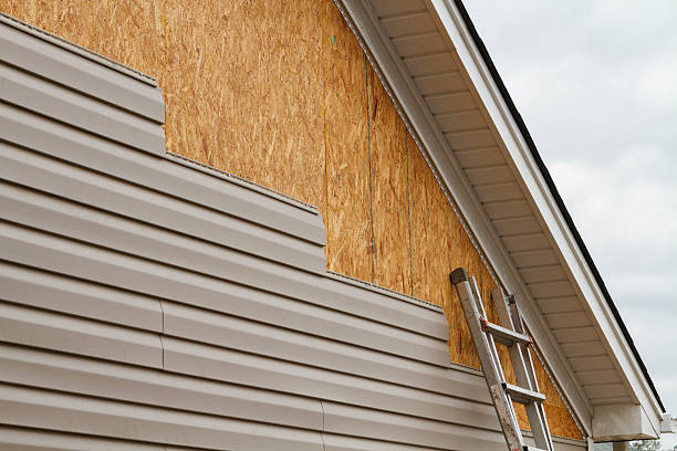 Professional Vinyl Siding technician working in West Union, OH